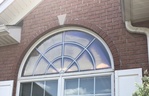 Cloudy arch top window with low e glass