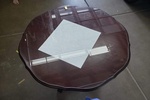 the paper towel will be replaced with small clear spacers so the wood table can breathe